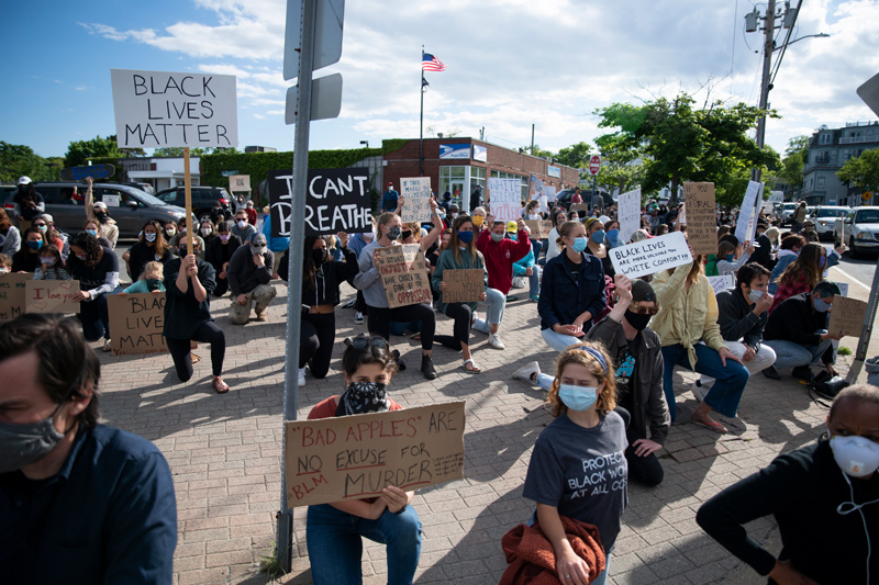 Vineyarders protest at Five Corners in June. —Lexi Pline